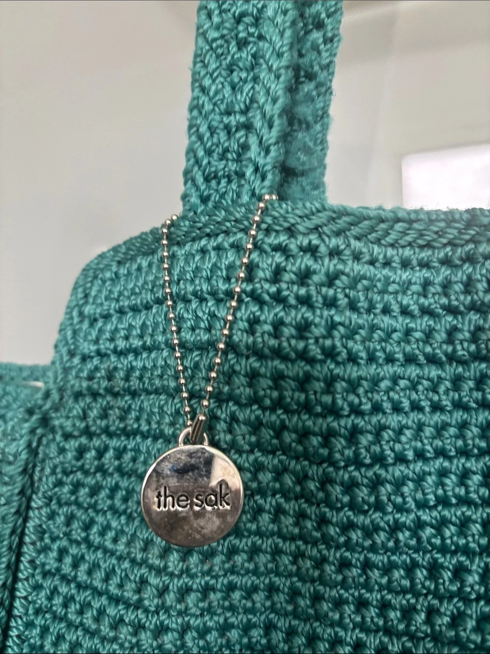 The Sak White Hobo with Teal Trim